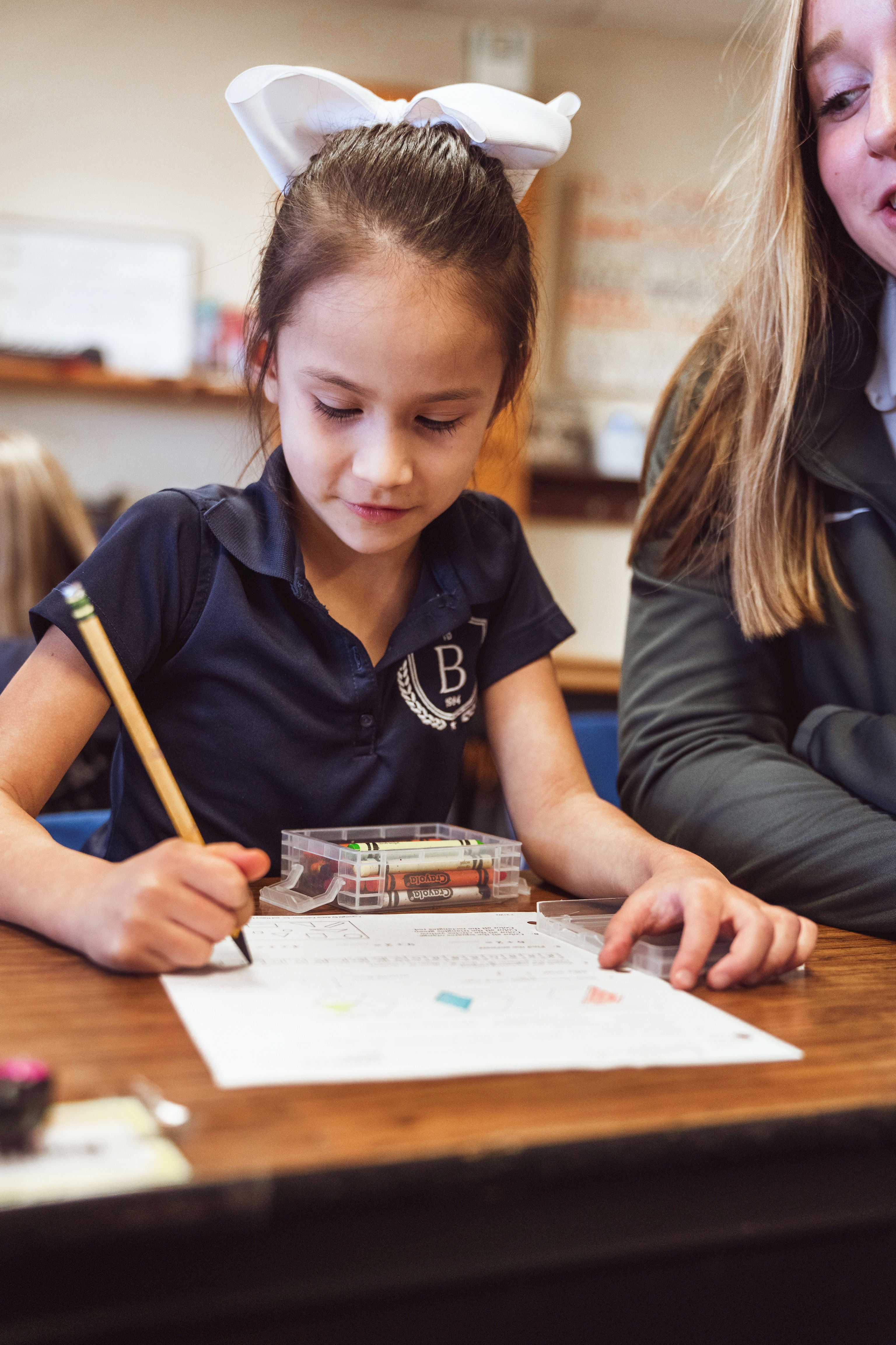 Elementary student in class with secondary students